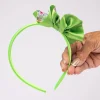 Handmade lime green kids headband showing satin bow detail